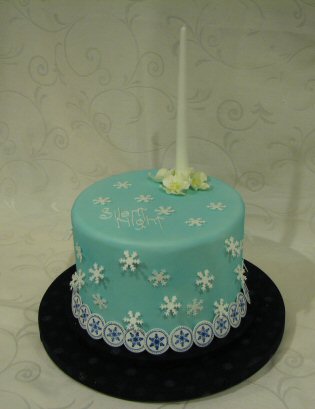 sugar candle on a blue christmas cake