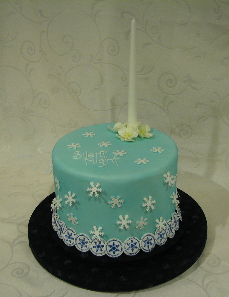 Blue christmas cake with sugar candle