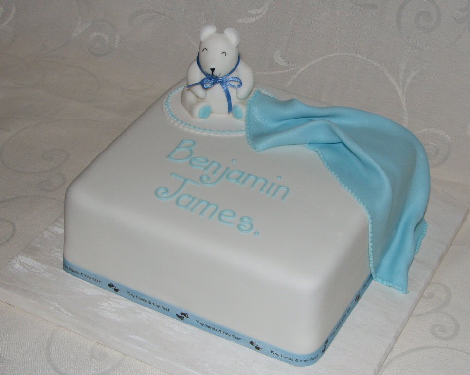 Naming ceremony cake or christening with teddy and blanket
